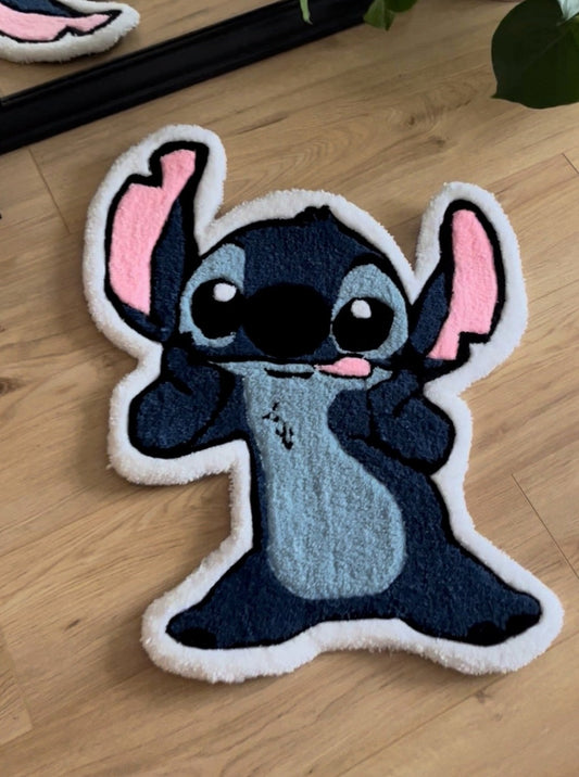 Shows our tufted rug of the Stitch character from the Disney movie Lilo and Stitch. Made by The Woollers